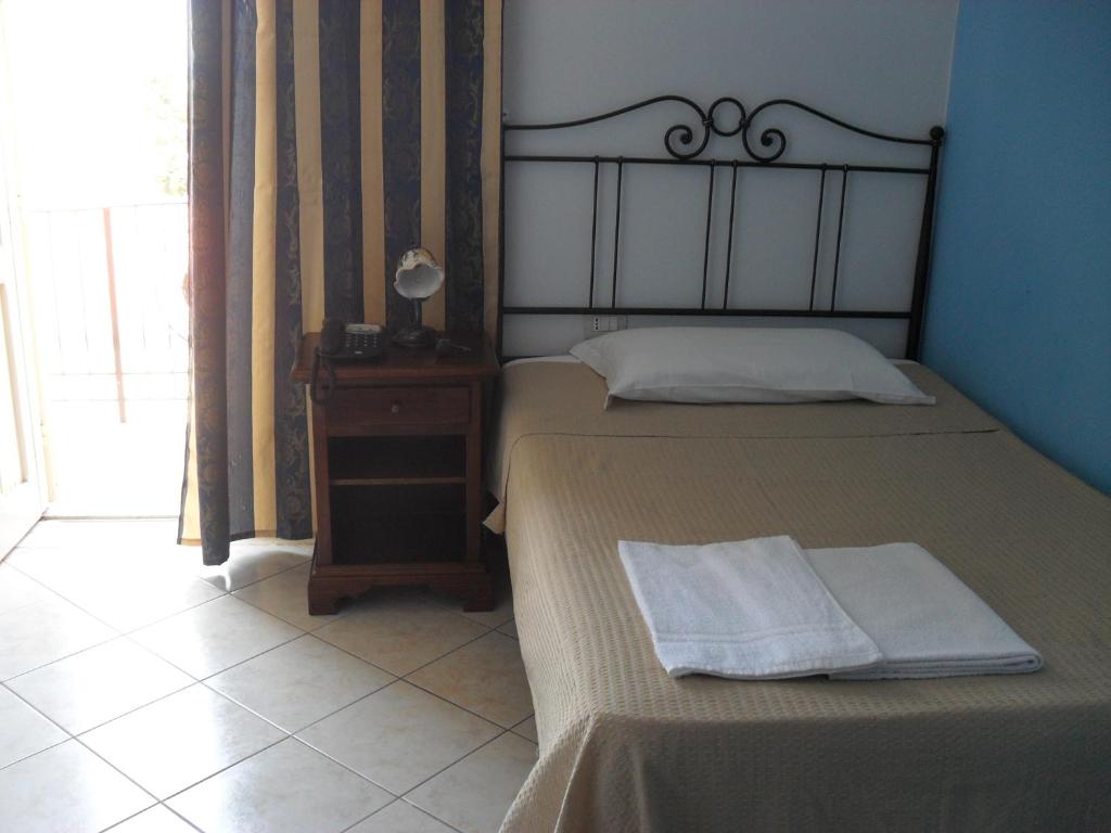 Posteľ alebo postele v izbe v ubytovaní Hotel Piro
