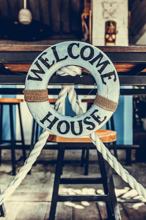 a sign that says navaho house sitting on a bench at WELCOMEHOUSE close to east beach, shops, restaurants and RAF base in Lossiemouth