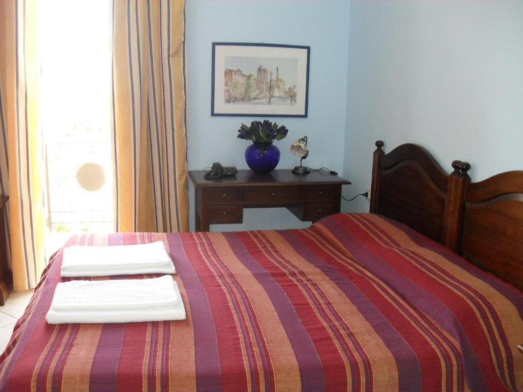 Posteľ alebo postele v izbe v ubytovaní Hotel Piro