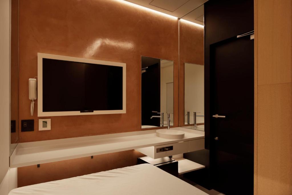 Postel nebo postele na pokoji v ubytování hotel min 大人専用
