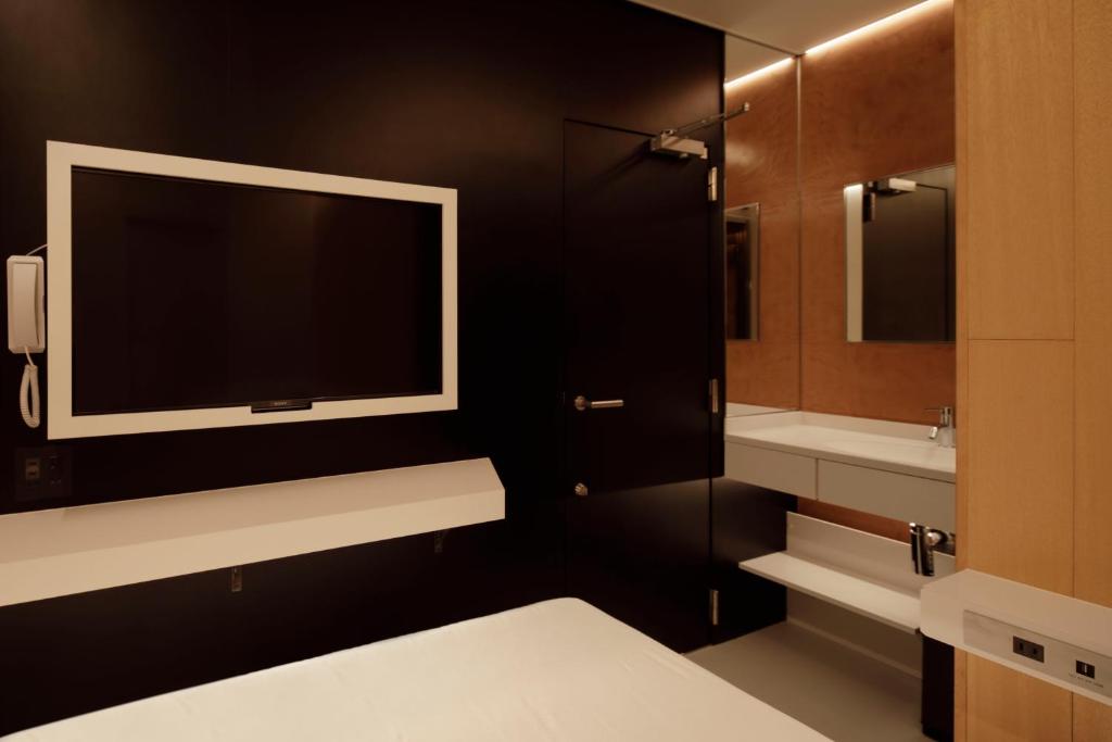 Postel nebo postele na pokoji v ubytování hotel min 大人専用