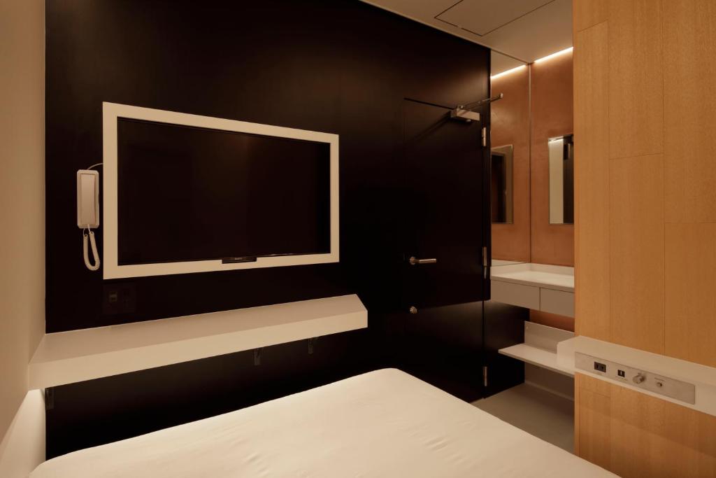 Postel nebo postele na pokoji v ubytování hotel min 大人専用