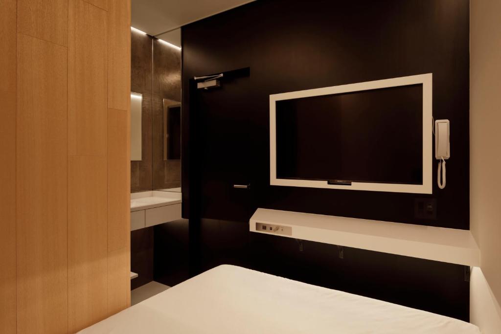 Postel nebo postele na pokoji v ubytování hotel min 大人専用