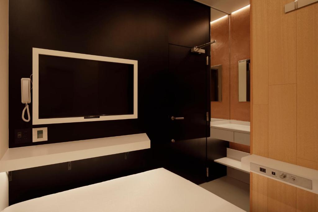 Postel nebo postele na pokoji v ubytování hotel min 大人専用