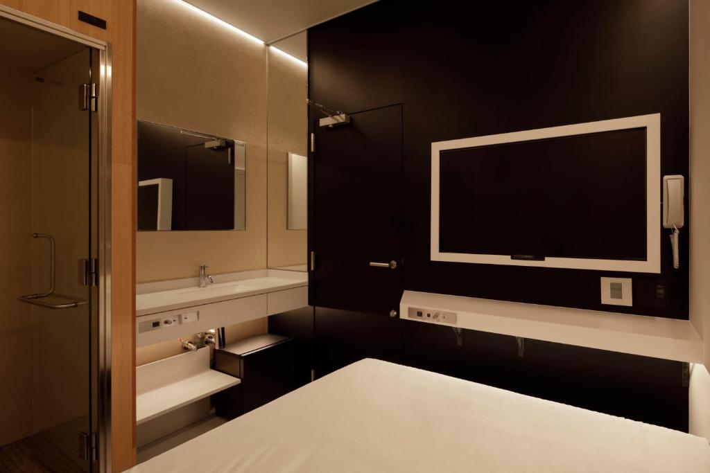 Postel nebo postele na pokoji v ubytování hotel min 大人専用