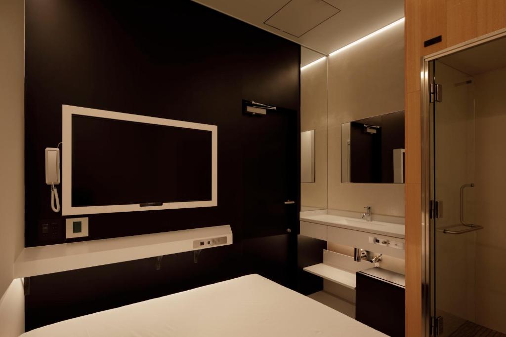 Postel nebo postele na pokoji v ubytování hotel min 大人専用