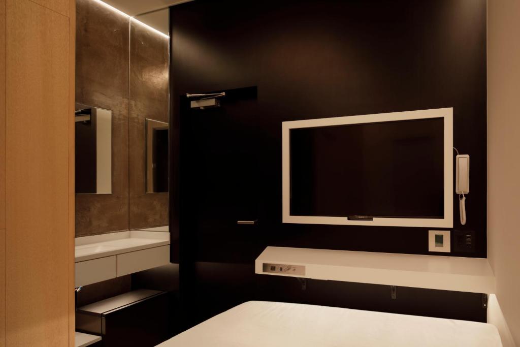 Postel nebo postele na pokoji v ubytování hotel min 大人専用