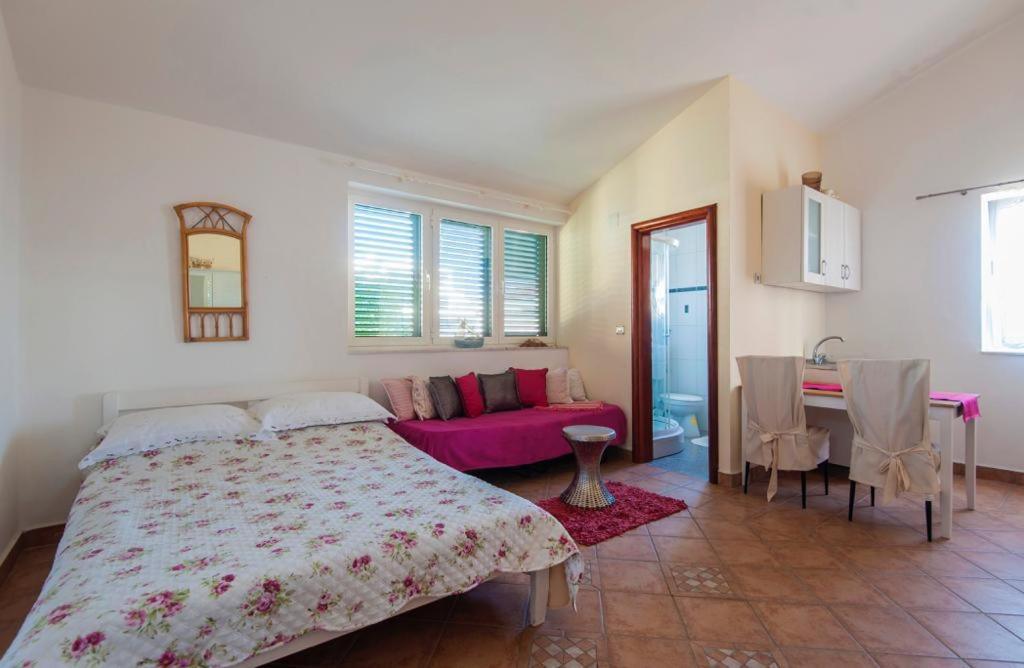 Łóżko lub łóżka w pokoju w obiekcie Resort Villa Moses
