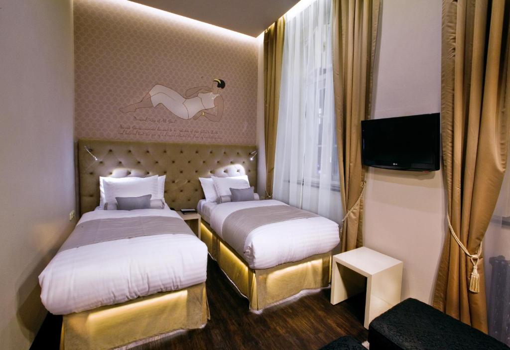 Łóżko lub łóżka w pokoju w obiekcie Design Hotel Jewel Prague