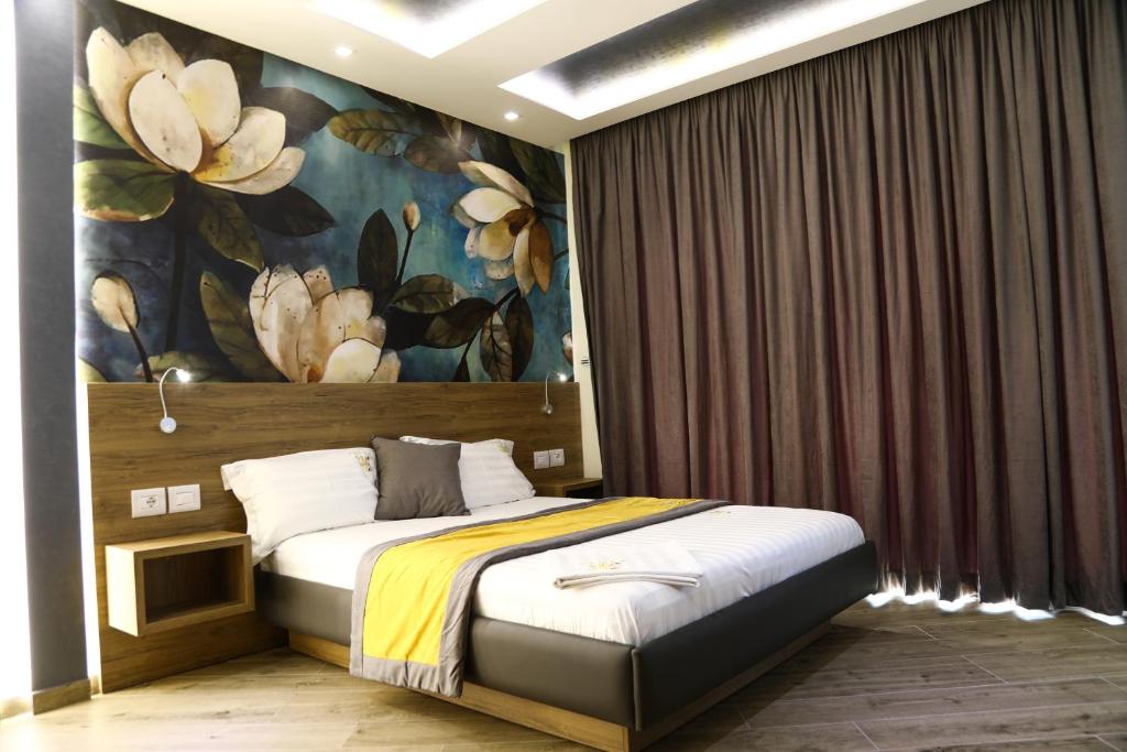Postel nebo postele na pokoji v ubytování Vila One Beach Hotel