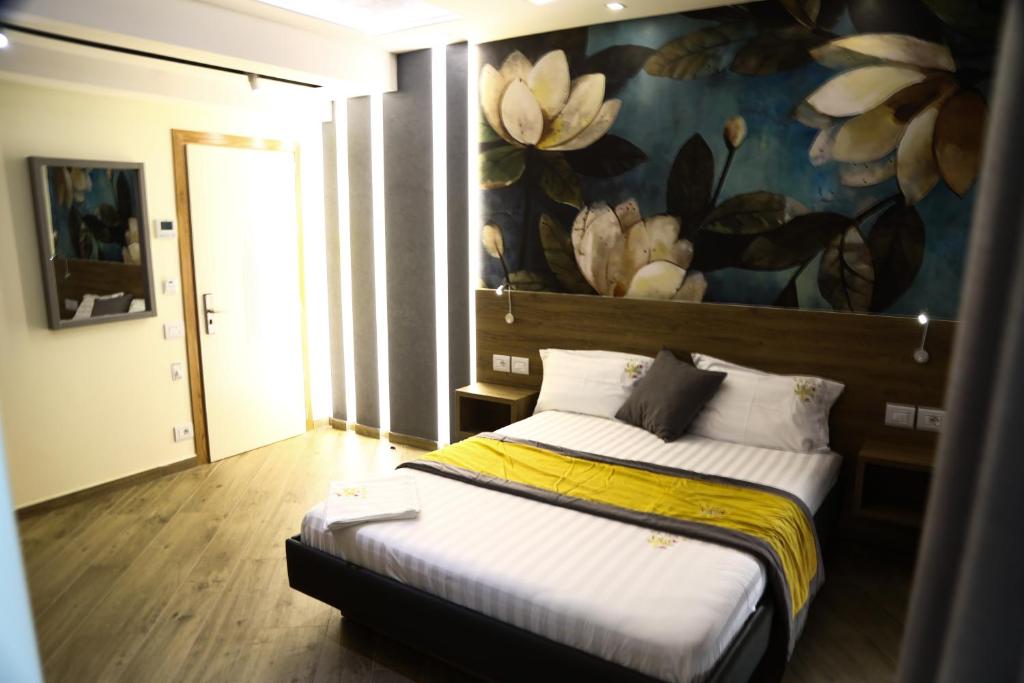 Postel nebo postele na pokoji v ubytování Vila One Beach Hotel