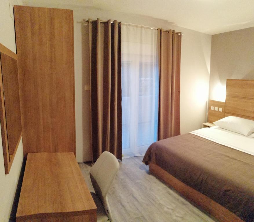 Postel nebo postele na pokoji v ubytování Apartmani Simon