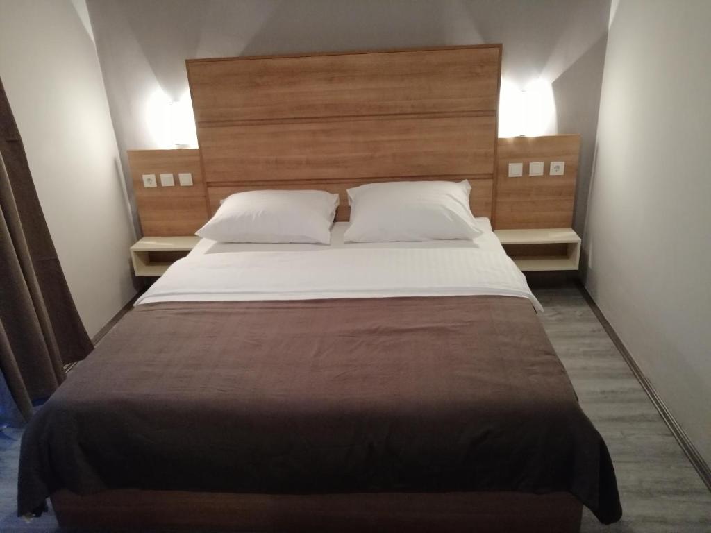 Postel nebo postele na pokoji v ubytování Apartmani Simon