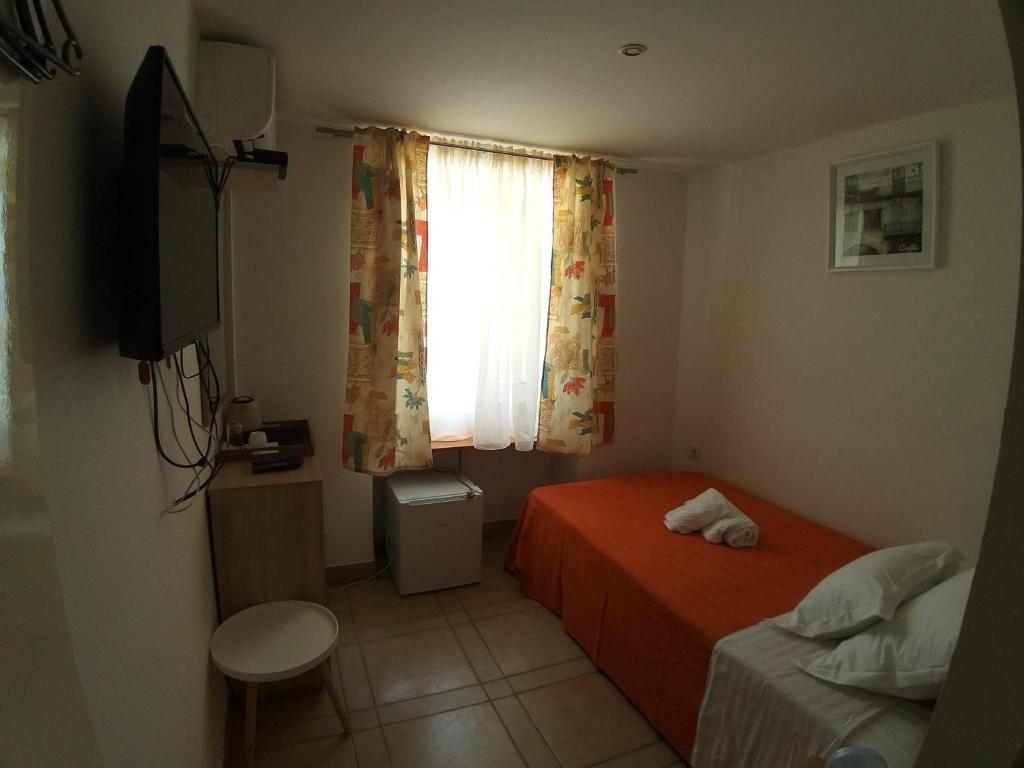 Postel nebo postele na pokoji v ubytování Riva Rooms
