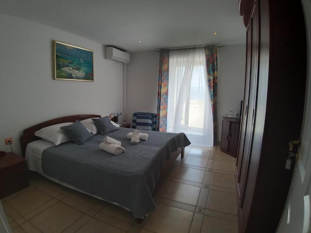 Postel nebo postele na pokoji v ubytování Riva Rooms