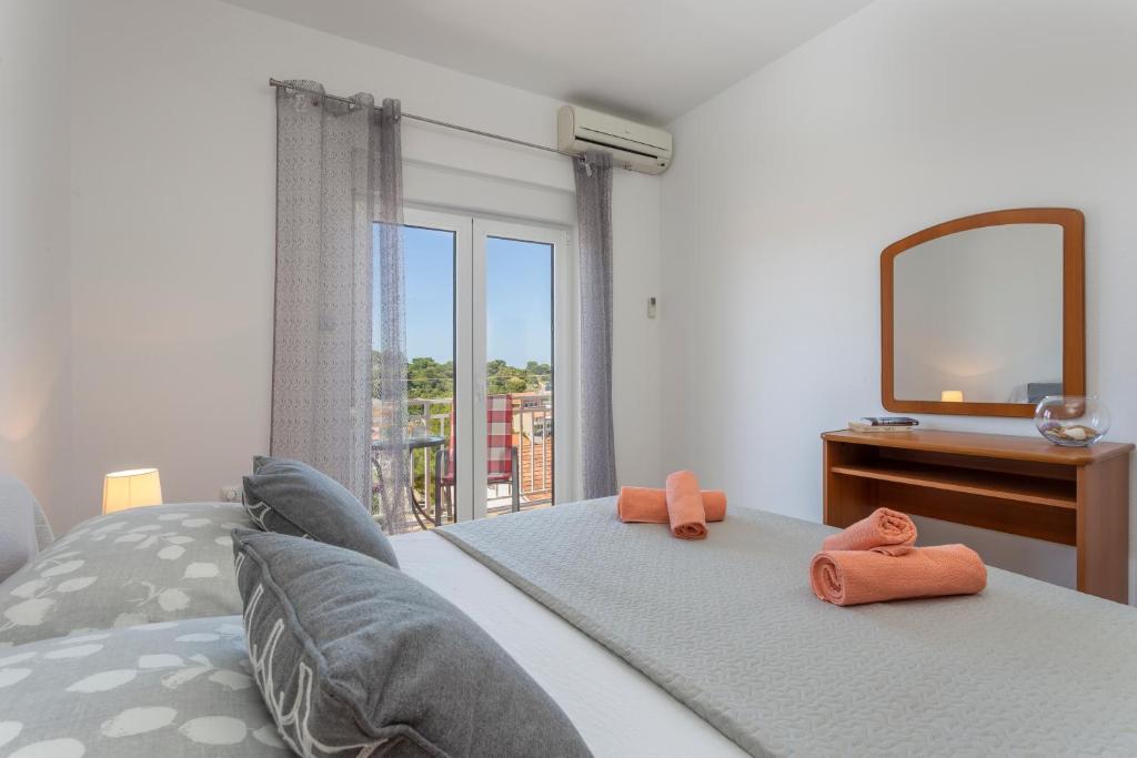 Posteľ alebo postele v izbe v ubytovaní Apartment Božo