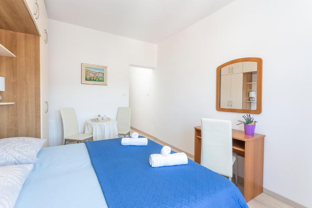 Posteľ alebo postele v izbe v ubytovaní Apartment Božo