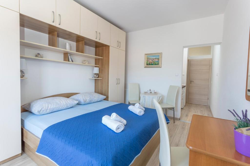 Posteľ alebo postele v izbe v ubytovaní Apartment Božo
