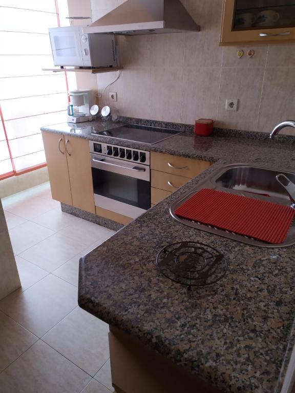 Kuchyň nebo kuchyňský kout v ubytování APARTAMENTO VILLA 3