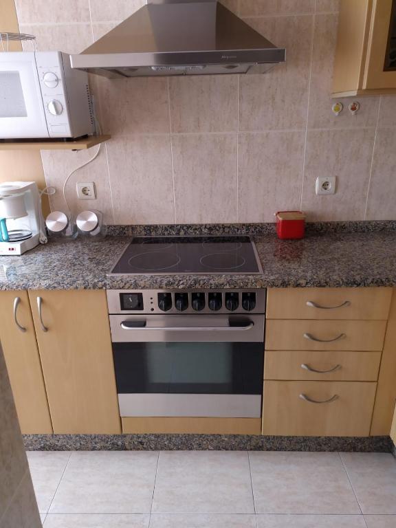 Kuchyň nebo kuchyňský kout v ubytování APARTAMENTO VILLA 3