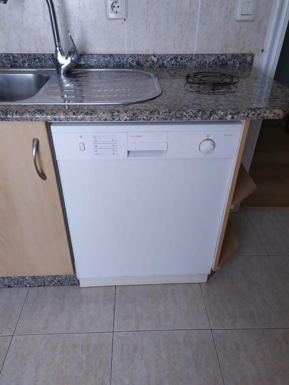 Kuchyň nebo kuchyňský kout v ubytování APARTAMENTO VILLA 3