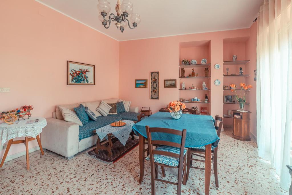 a living room with a couch and a table at Theokles Apartment in Taormina