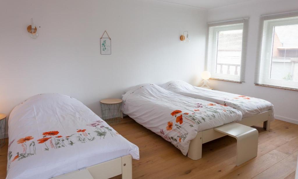 Postel nebo postele na pokoji v ubytování Vakantiehuis Elisa