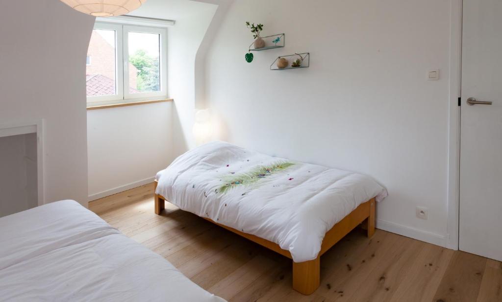 Postel nebo postele na pokoji v ubytování Vakantiehuis Elisa
