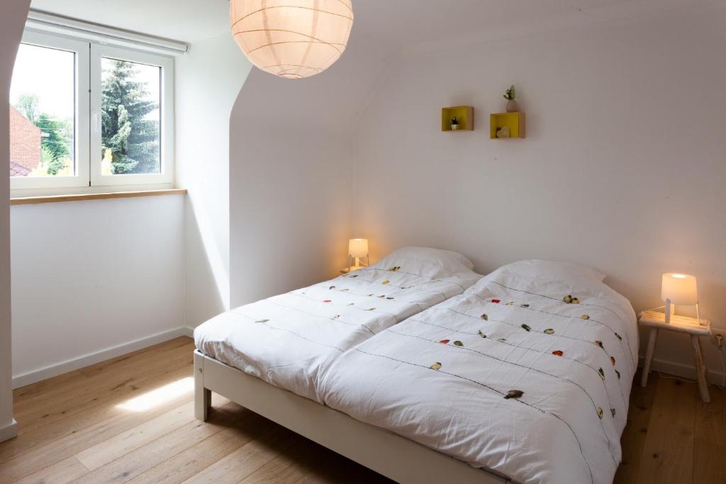 Postel nebo postele na pokoji v ubytování Vakantiehuis Elisa