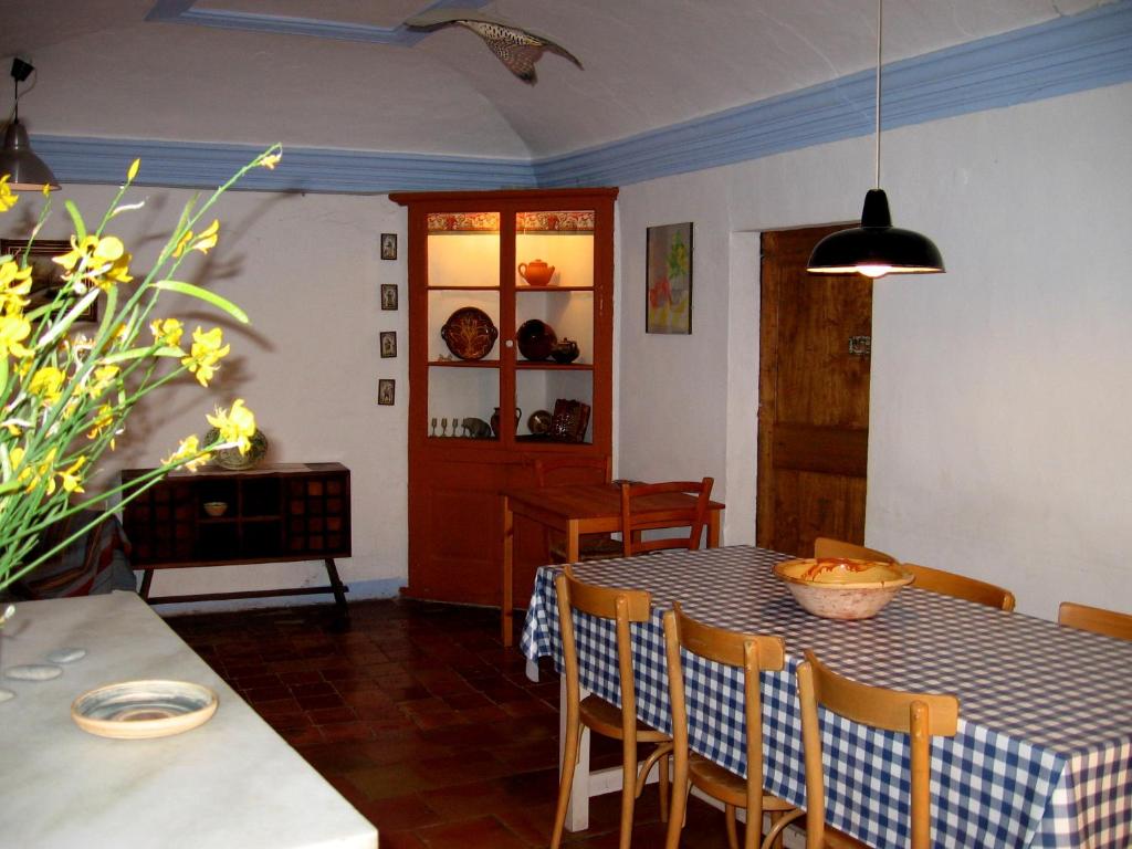 a dining room with a table and chairs at Can Corretjola in Navata