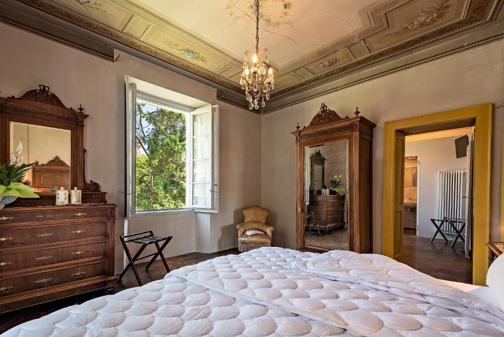 Postel nebo postele na pokoji v ubytování B&B Villa Rosalinda