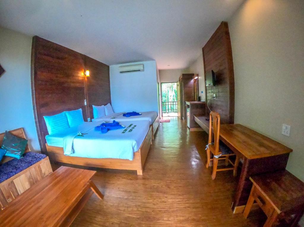 Postel nebo postele na pokoji v ubytování The Cinnamon & SaphanSufan Resort Kohmak