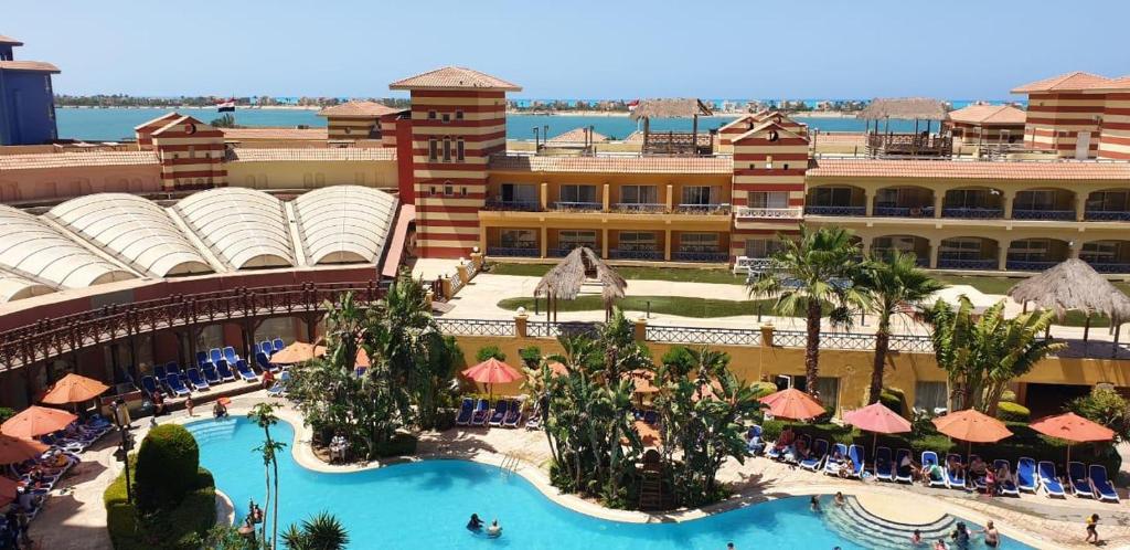 an aerial view of a resort with a swimming pool at For Families only Porto Marina in El Alamein