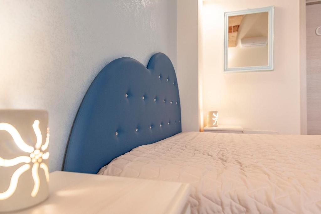 Łóżko lub łóżka w pokoju w obiekcie B&B Casa di Anita