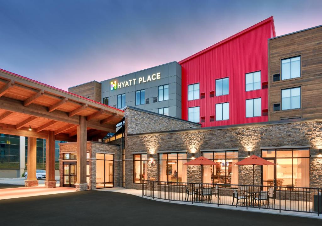 a large building with a lot of windows at Hyatt Place Anchorage-Midtown in Anchorage