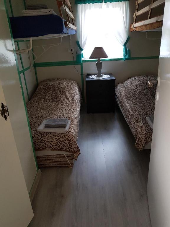 Postel nebo postele na pokoji v ubytování Leszkowo