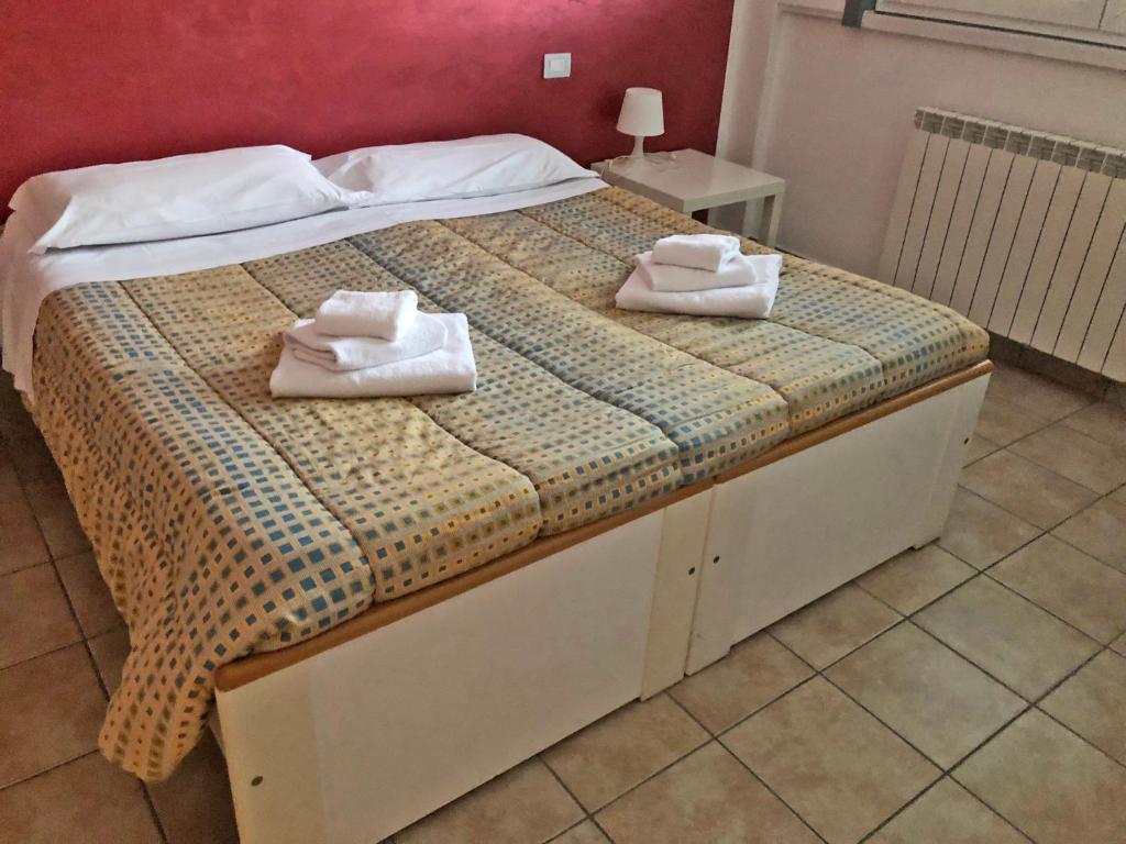 Postel nebo postele na pokoji v ubytování La Chiocciola Guesthouse Briantea
