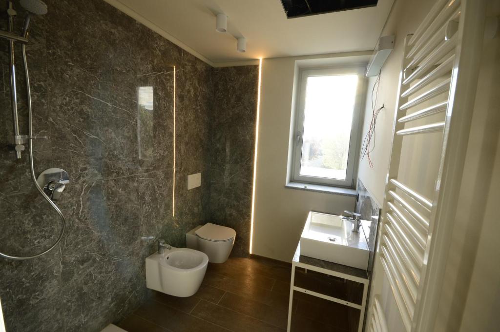 Koupelna v ubytování ATMOSFERA APARTMENTS & SUITES