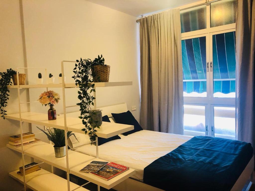Postel nebo postele na pokoji v ubytování La Perla Apartment BY NAMASTE ELITE