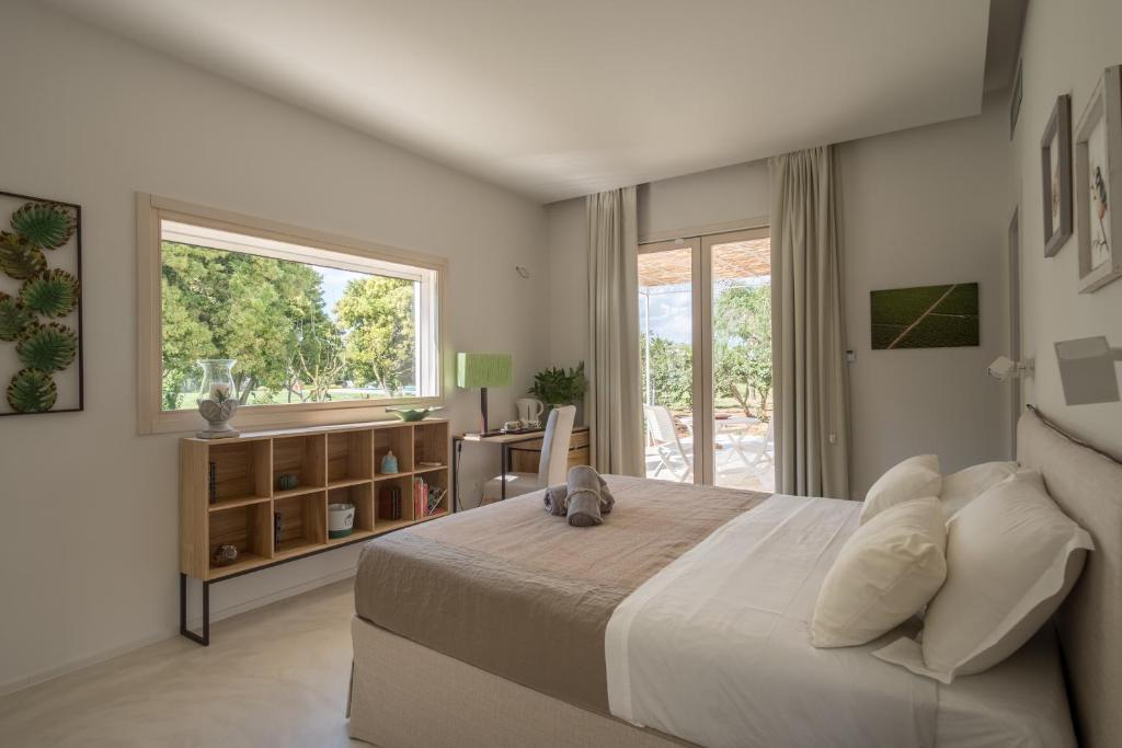 Postel nebo postele na pokoji v ubytování Tenuta DonnAnna Agriturismo&Glamping