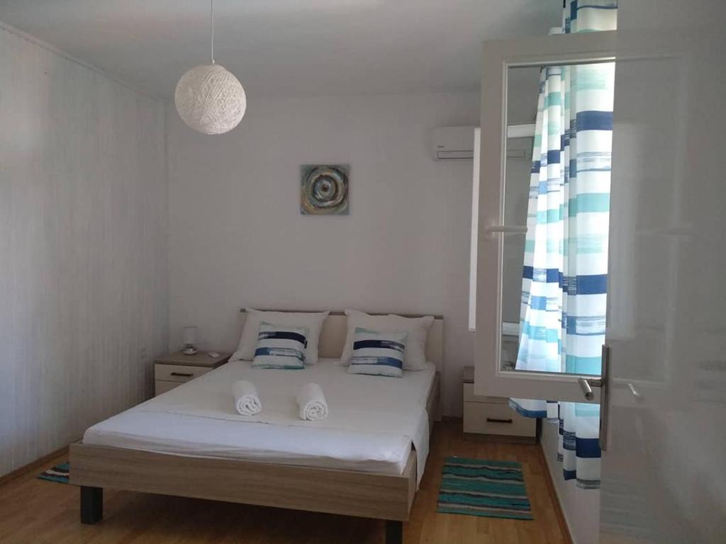Postel nebo postele na pokoji v ubytování Apartments Laus