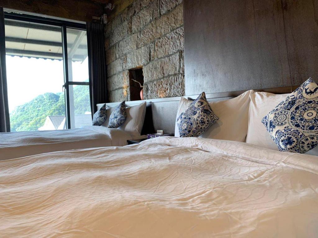 Postel nebo postele na pokoji v ubytování M Bar House