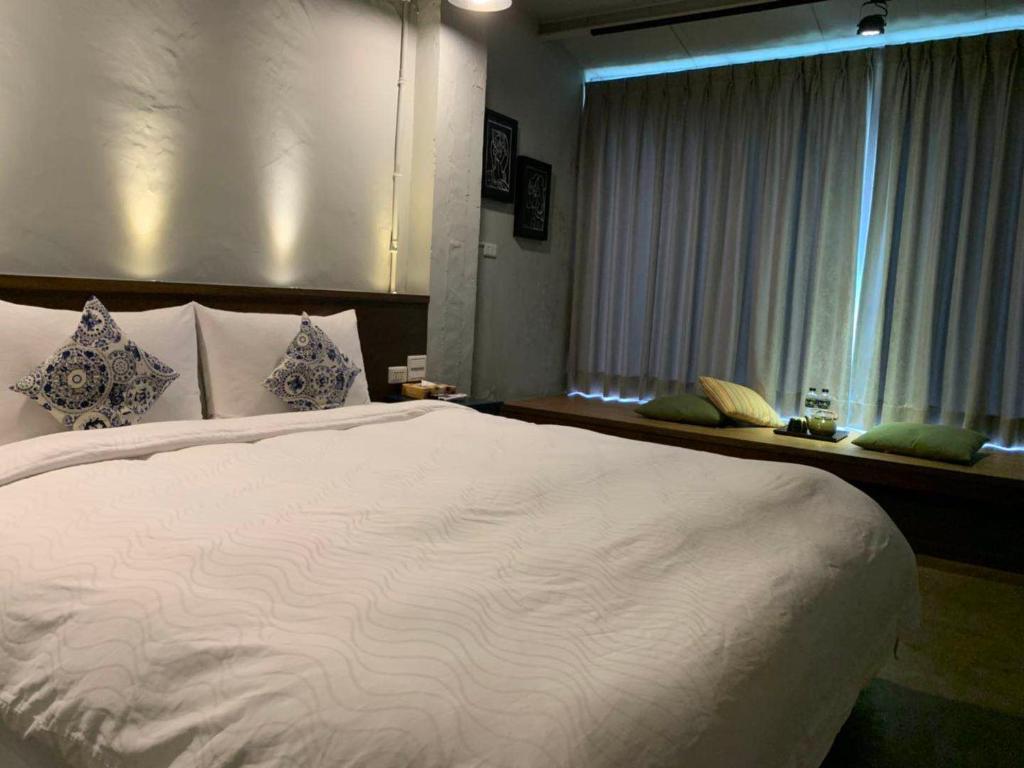 Postel nebo postele na pokoji v ubytování M Bar House