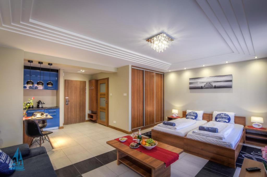 Ένα ή περισσότερα κρεβάτια σε δωμάτιο στο A3 - APARTAMENTY