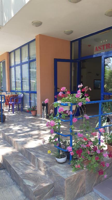 a building with some flowers on a patio at Complex Astra in Sunny Beach