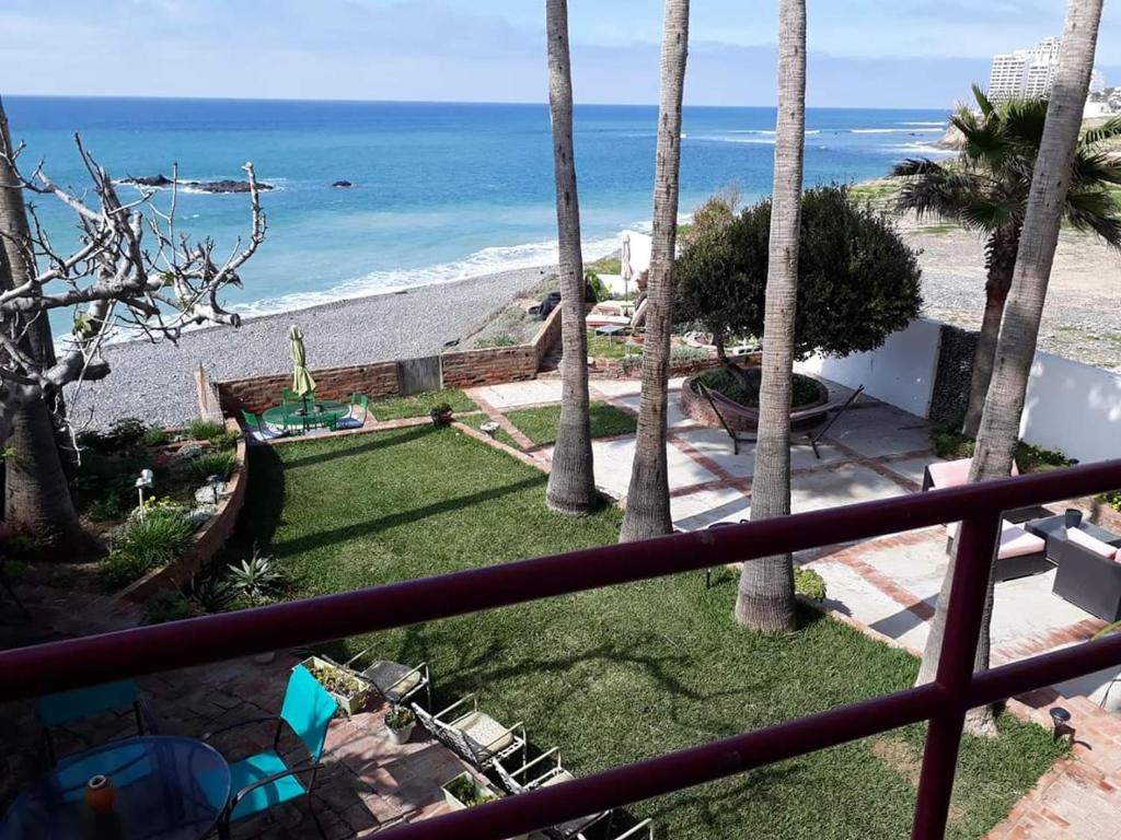a balcony with a view of the beach at Hacienda Rancho Santini in Rosarito