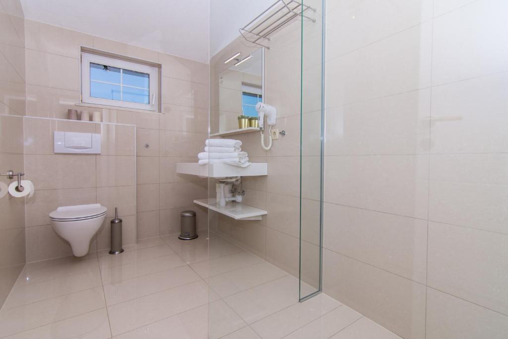 Kúpeľňa v ubytovaní Apartmani Juric