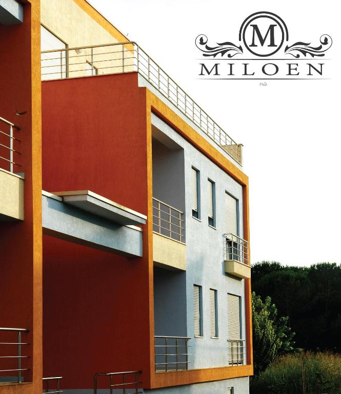 a rendering of a building with red and white at Miloen Residence Gjiri I Lalzit in Draç