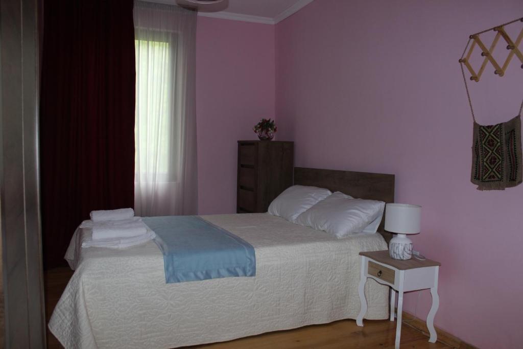Postel nebo postele na pokoji v ubytování Village House