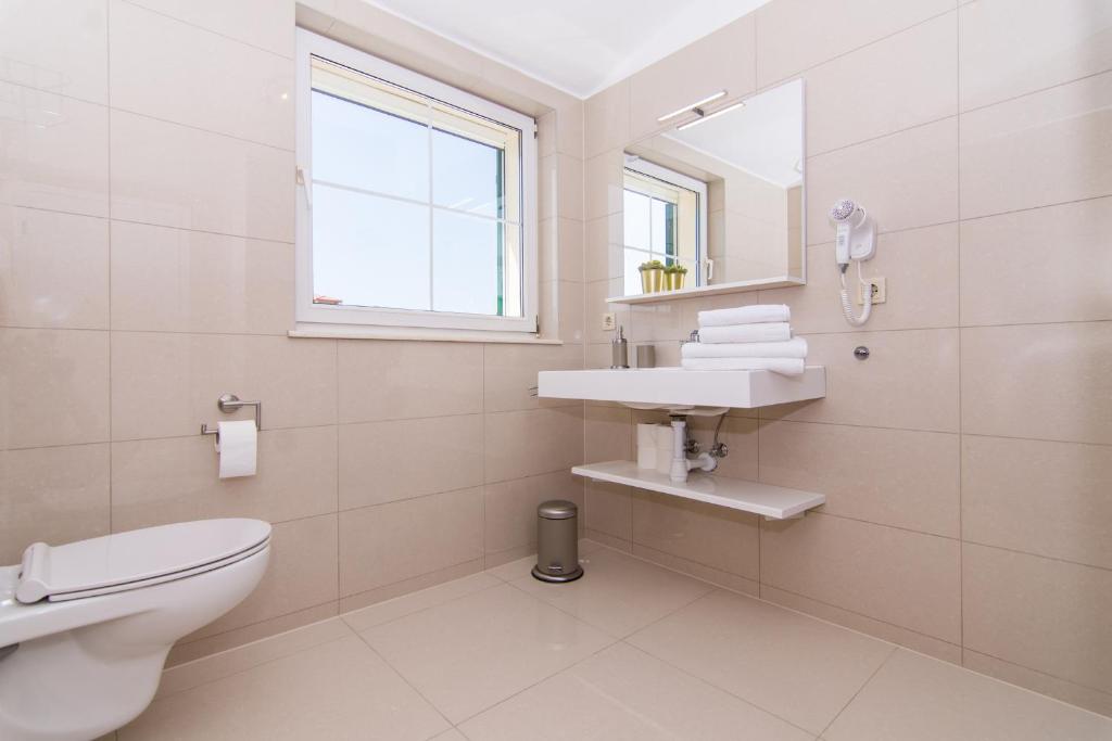 Kúpeľňa v ubytovaní Apartmani Juric